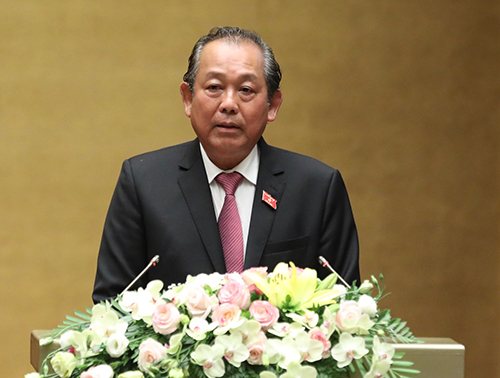 Phó Thủ tướng Thường trực Chính phủ Trương Hòa Bình trình bày báo cáo trước Quốc hội. Ảnh VGP/Nhật Bắc